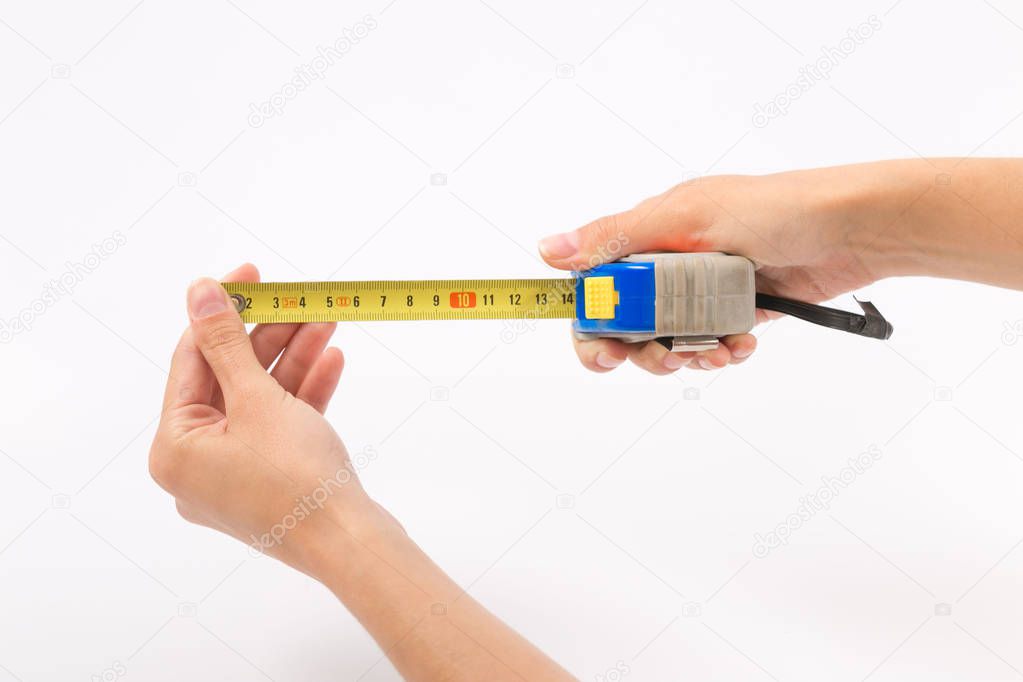 Female hands on a white background with a tape measure
