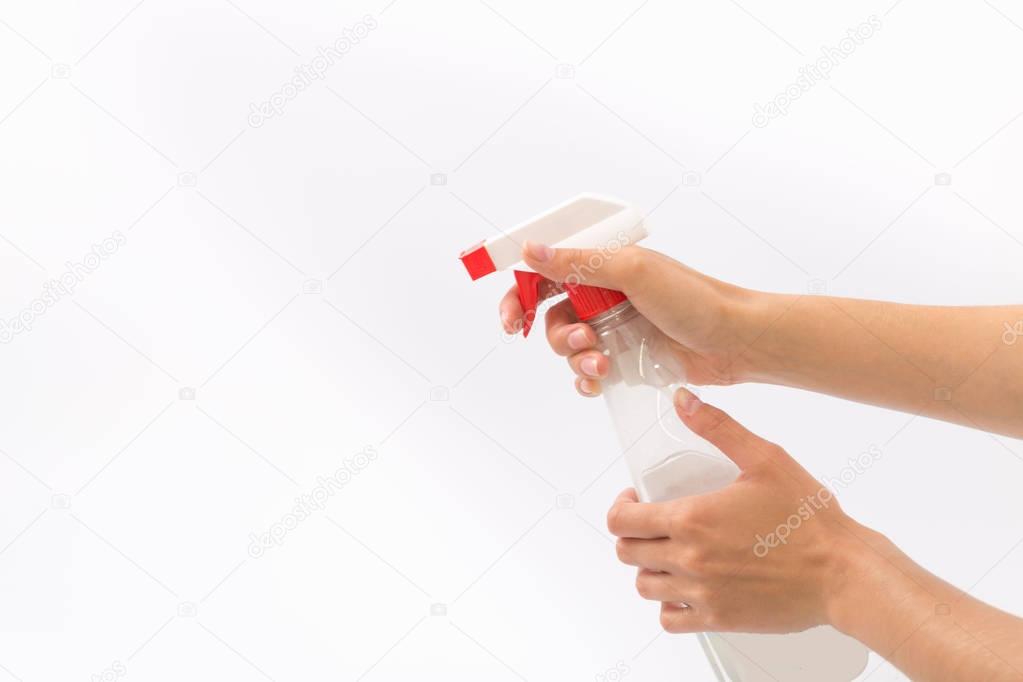 Female hands on a white background with a nebulizer