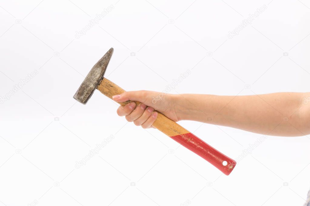 Female hands on a white background with a hammer.