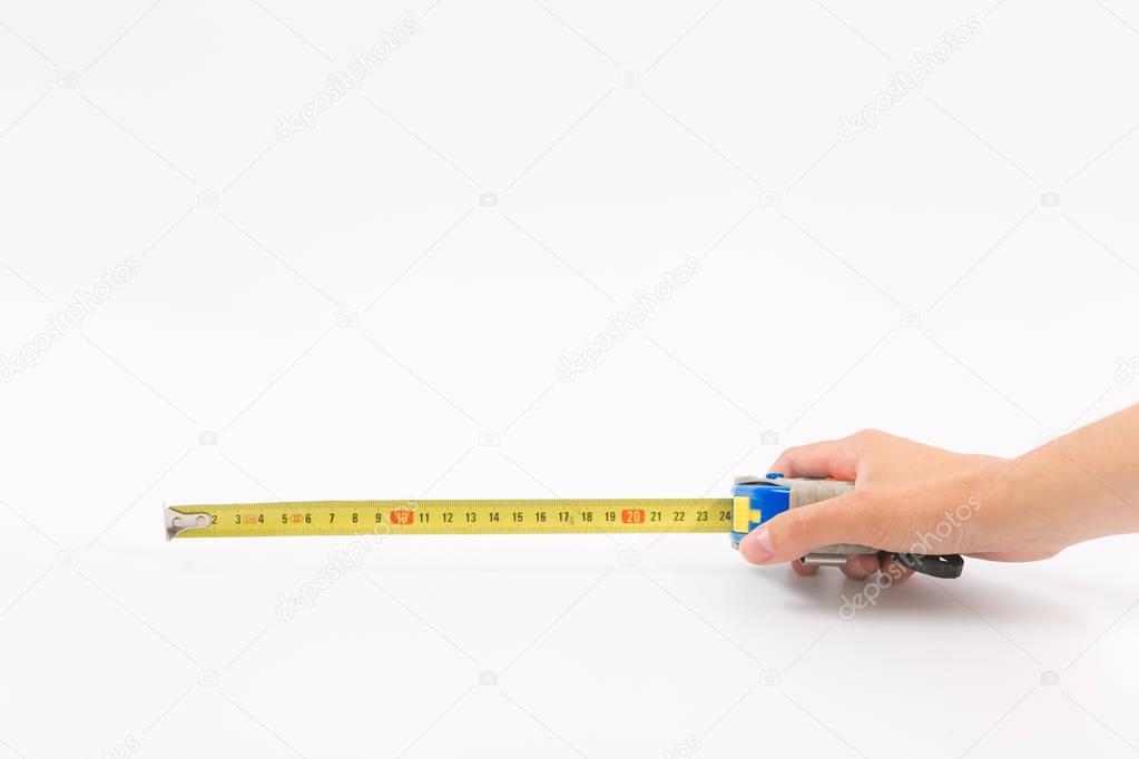 Female hands on a white background with a tape measure