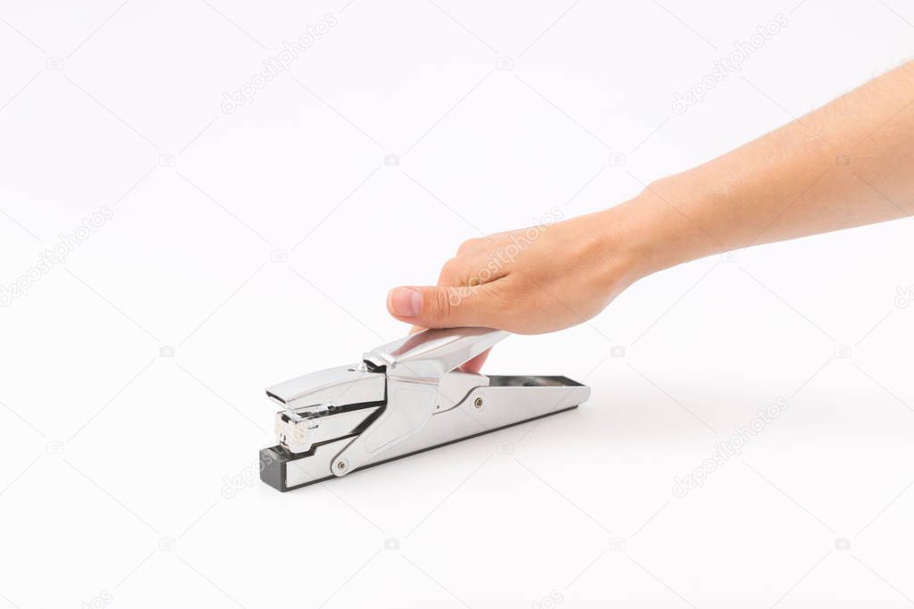 Female hands on a white background with a stapler.