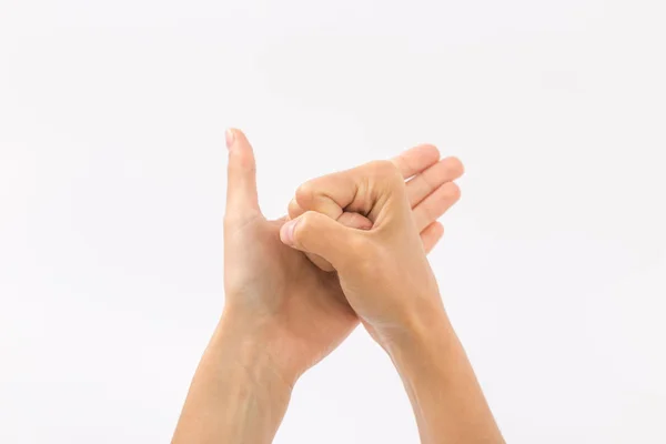 Γυναικεία χέρια σε λευκό φόντο. Χειρονομίες — Φωτογραφία Αρχείου