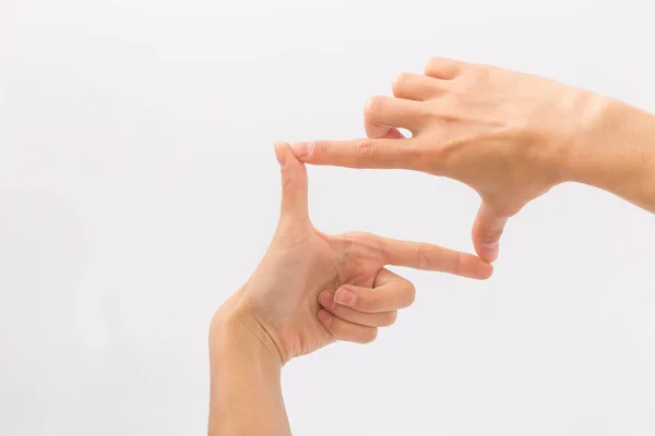 Mani femminili su sfondo bianco. Gesti — Foto Stock