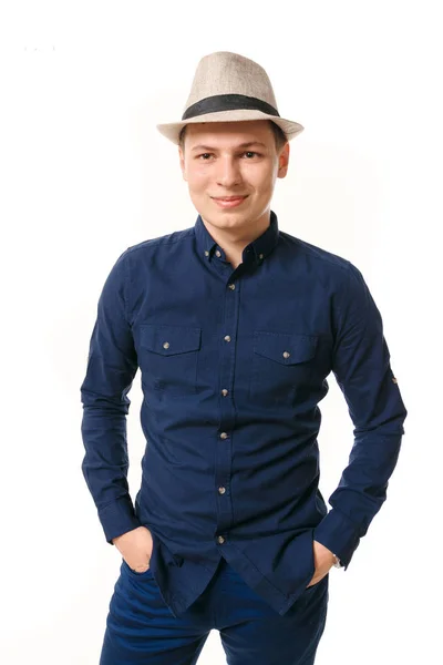 Young man in blue clothes on a white background. — Stock Photo, Image