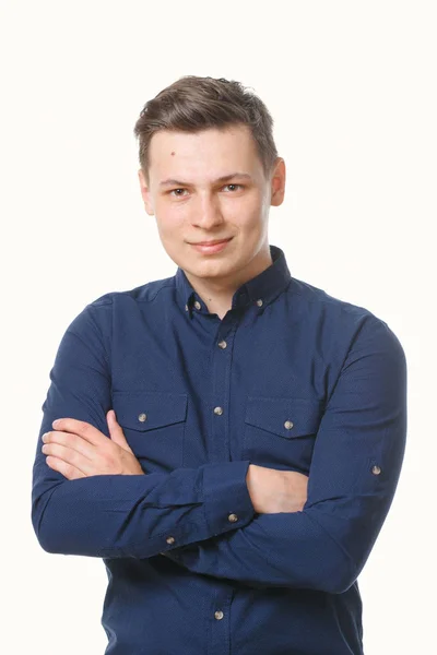 Joven vestido de azul sobre un fondo blanco . — Foto de Stock