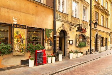 Warsaw, Poland - August 2, 2017: Architecture and people on the street New World in Warsaw. clipart