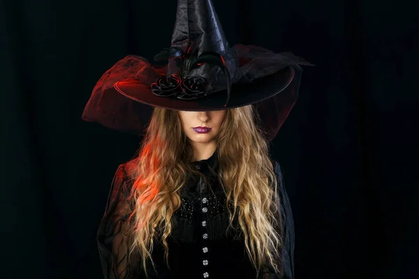 Cheerful girl witch on halloween in studio. — Stock Photo, Image