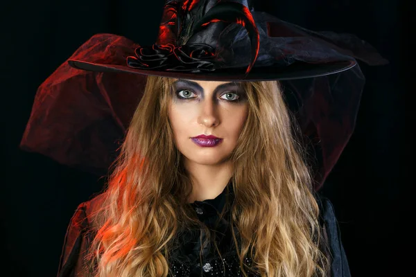 Cheerful girl witch on halloween in studio. — Stock Photo, Image