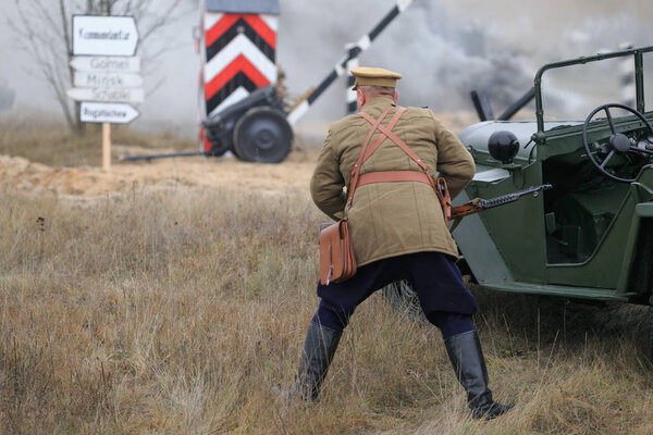 Gomel, Belarus - November 26, 2017: Re-enactors Dressed As German Soldiers In WW II Are Fighting With A Cannon. Celebration Of 74 Anniversary Of Liberation Of Gomel From Nazi Invaders.