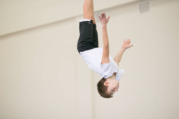 GOMEL, BELARUS - 25 November 2017: Freestyle competitions among young men and women in 2005-2007. In the program, trampoline and gymnastic path.