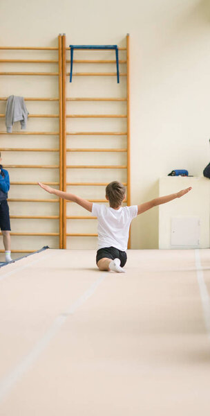 GOMEL, BELARUS - 25 November 2017: Freestyle competitions among young men and women in 2005-2007. In the program, trampoline and gymnastic path.