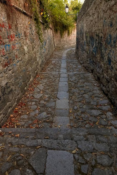A narrow street of italy with steps of stone. Monselice, Italy