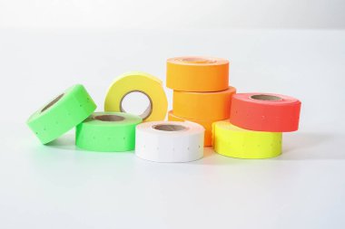 colored commercial stickers in rollers. double scotch tape. clipart