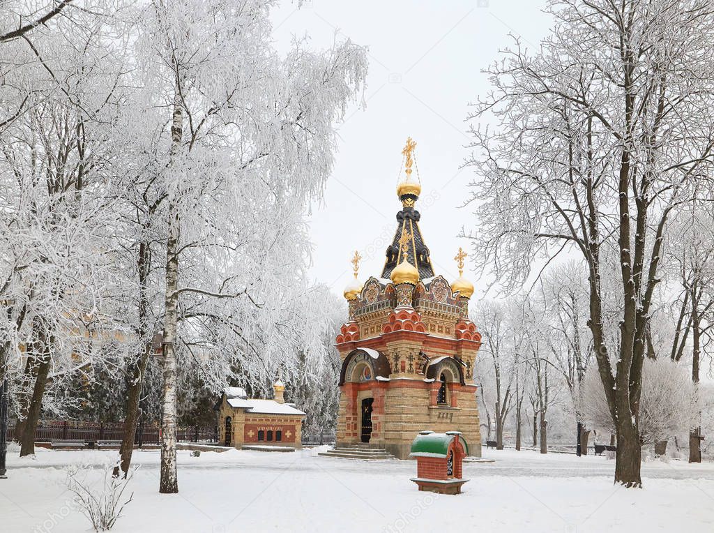 GOMEL, BELARUS - JANUARY 23, 2018: Shrine at the Cathedral of Peter and Paul in the city park in icy frost.
