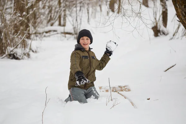 Winter fun. teenager having fun playing with snow. — Stock Photo, Image