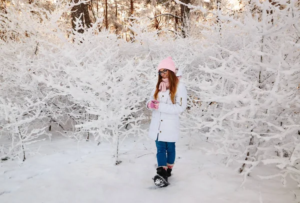 Girl in winter forest with snow-covered branches of trees. fairy beauty. — Stock Photo, Image