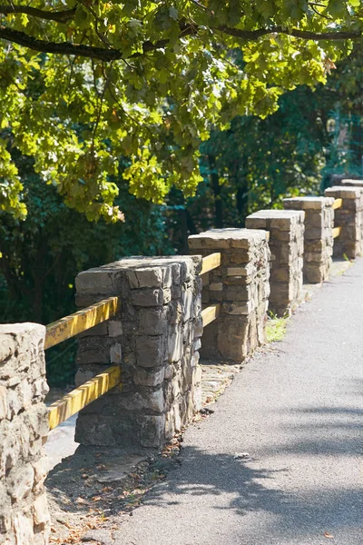 A stone hedge along the cliff. Bergamo Italy.