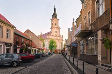 Wolsztyn, POLAND - August 27, 2017: Parish Church at Koscielna Street. clipart