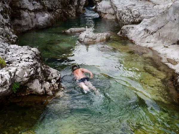 A man swims in a mountain river. Italy — ストック写真