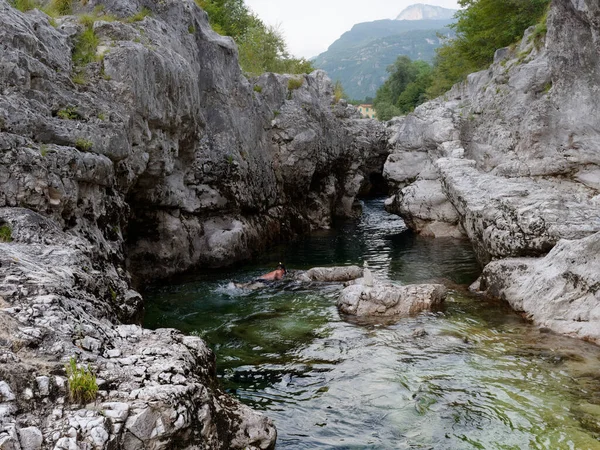 A man swims in a mountain river. Italy — Φωτογραφία Αρχείου