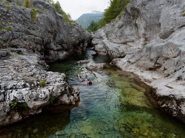 A man swims in a mountain river. Italy — Φωτογραφία Αρχείου