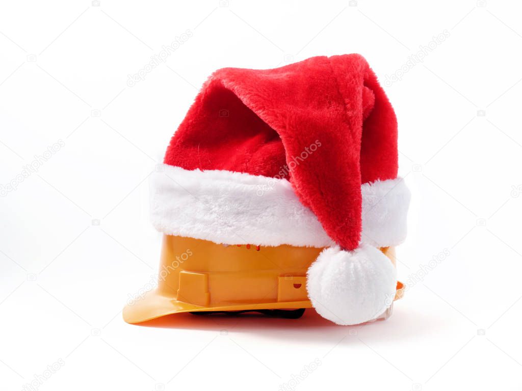 Builder's hard hat in santa hat on white background