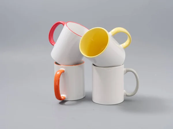 Colored cups for sublimation in composition on a gray background — 스톡 사진