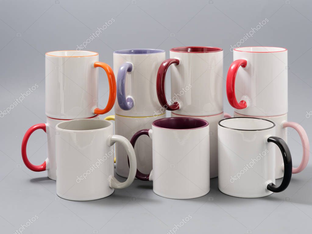 Colored cups for sublimation in composition on a gray background 2020