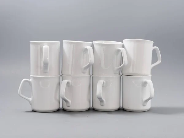 White cups for sublimation in composition on a gray background — 스톡 사진