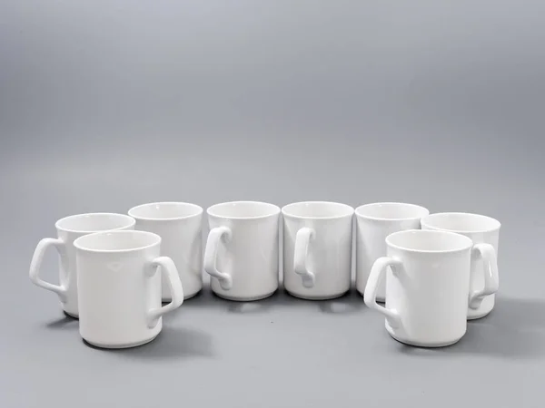 White cups for sublimation in composition on a gray background — 스톡 사진