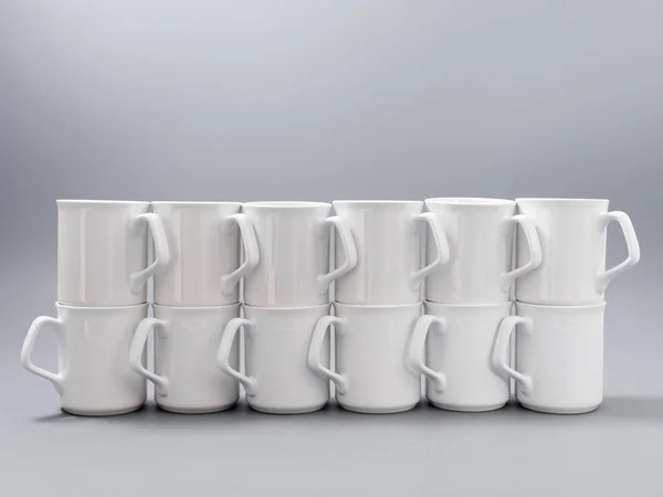 White cups for sublimation in composition on a gray background — Stock Photo, Image