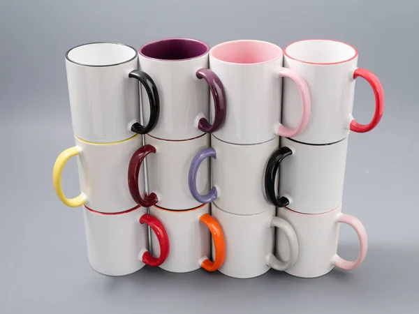 Colored cups for sublimation in composition on a gray background — 스톡 사진