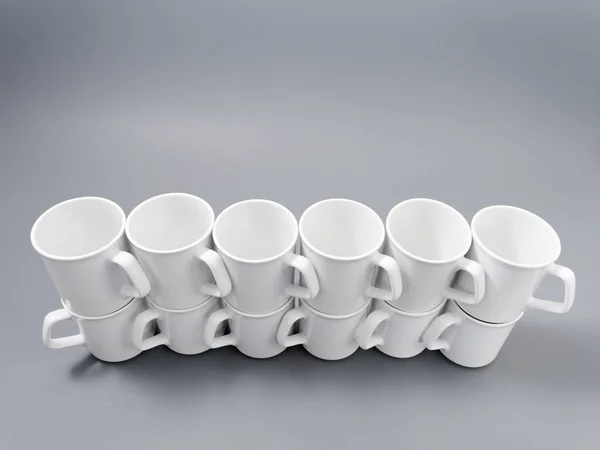 White cups for sublimation in composition on a gray background — 스톡 사진