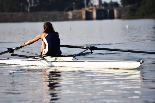 Scull rowing team training.