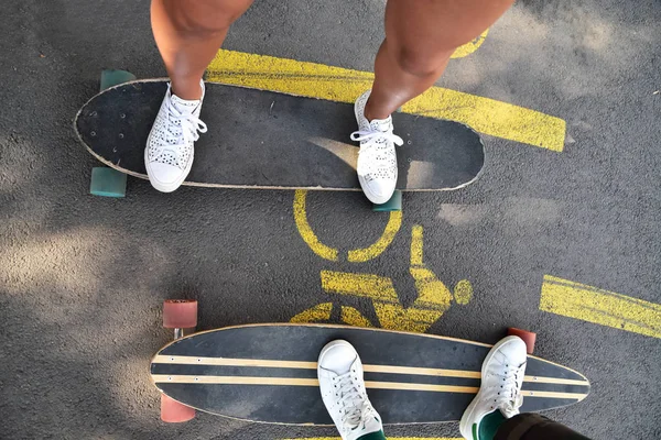 Longboarding, skateboarding, fun sport in a city park