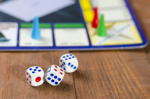 Cubes with the game monopoly on the table