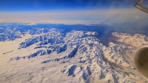 Vew of the snow-covered volcano from the airplane window — Stock Video