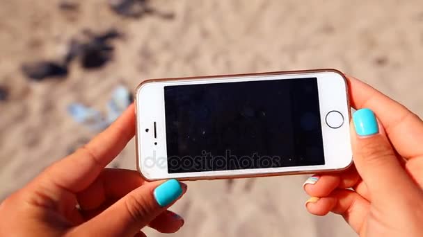 Word summer from sea stones laid out on sand — Stock Video