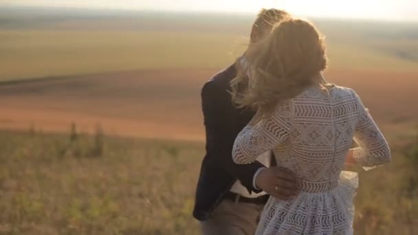 Sensual young couple in love on the background meadows. — Stock Video