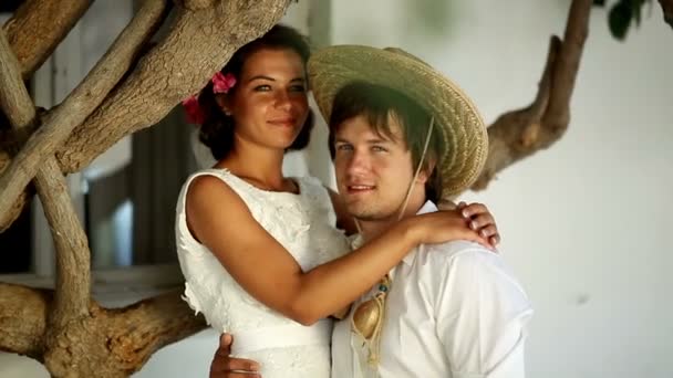 Beautiful newlyweds kiss on the street. Greece — Stock Video