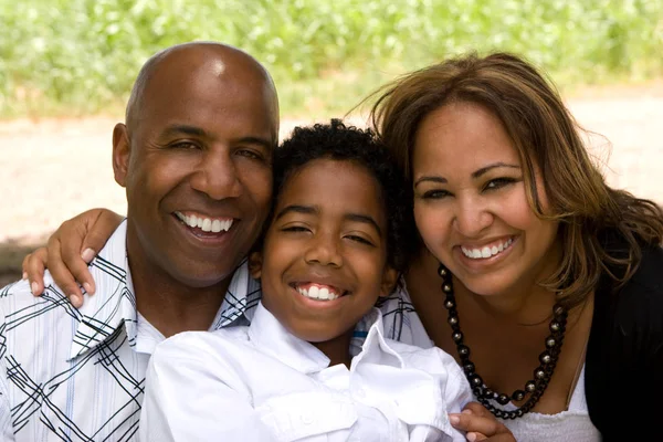 Portrait of happy multicultural family smiling. — Stock Photo, Image