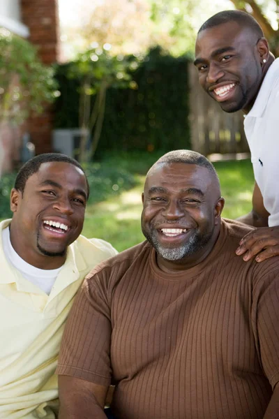 African American father and his adult sons. — Stock Photo, Image