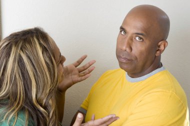 Unhappy couple arguing and having relationship problems. clipart