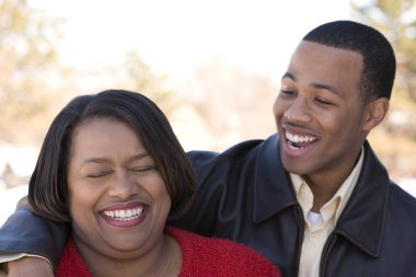 African American mother and her adult son. clipart