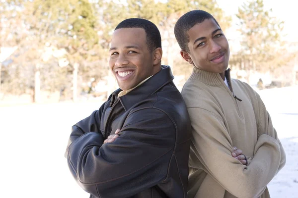 Portrait of African American teenage brothers smiling. — Stock Photo, Image