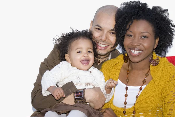 Loving multicultural parents and their daughter smiling. — Stock Photo, Image