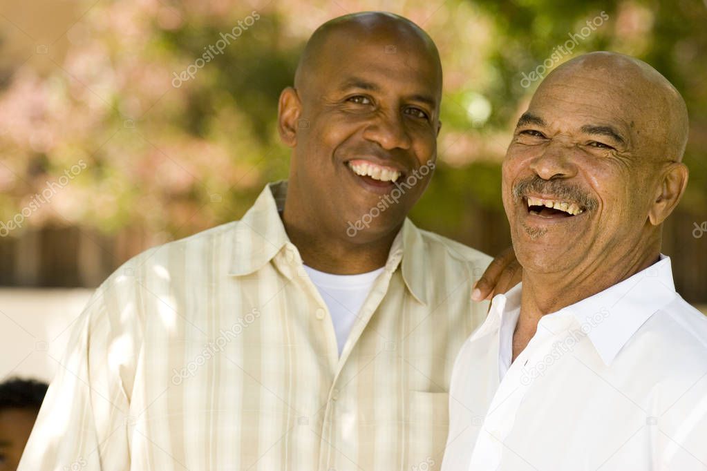 African American father and his adult son.