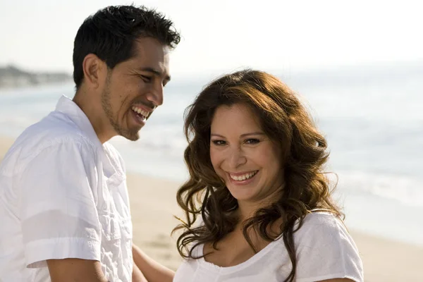 Beautiful Hispanic couple laughing and smiling. — Stock Photo, Image