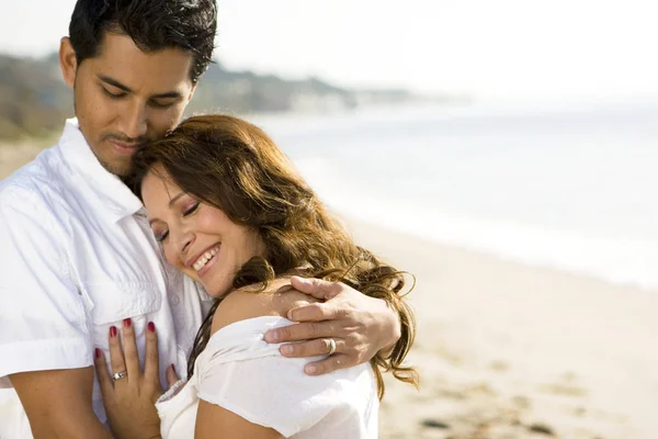 Beautiful Hispanic couple laughing and smiling. — Stock Photo, Image