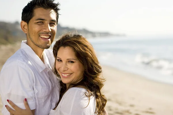 Beautiful Hispanic couple laughing and smiling. — Stock Photo, Image